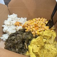 Curry tofu with coconut rice, corn salsa and callaloo  at The Floribbean in St Petersburg