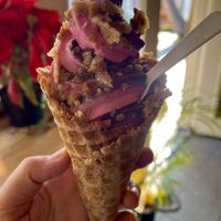 Regular waffle cone with Aloha strawberry and blueberry Ube swirl topped with waffle chips! Sooo good at Sweet Journey Soft Serve in Kailua Kona