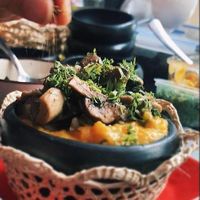 Sango de choclo y trilogía de hongos criollos.

Corn puree with mushroom trilogy. Local flavors (cumin, cilantro, garlic) at La Suculenta in Guayaquil