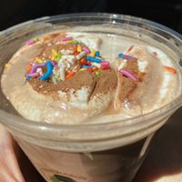 Chocolate milk (Oatly) with whipped cream and sprinkles! at Hail Snail in Portland