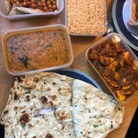 Garlic naan, tarka dal, jeera potatoes, chana puri and stir fried basmati rice. at Green Gates Indian Restaurant in Stirling