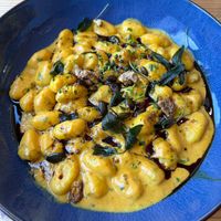 Pumpkin gnocci with candied walnuts, sage and green salad on the side at Heuriger Steinschaden in Langenlois