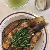 Eggplant rice comes with cold green tea and some lightly pickled onions  at LoveUrth 러브얼스 in Busan