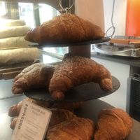 Delicious apricot filled vegan croissants on top shelf   at Espresso Bar in Berlin