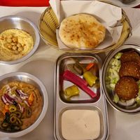 Vegan half breakfast; hummus, falafel, foul madamas, pickles, tahini and pitta at Time Out Cafe in Glasgow