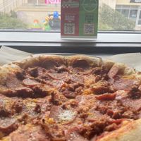 Sausage & Pepperoni pizzaa  at Down 2 Earth Plant Based Cuisine in Las Vegas