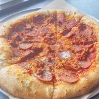 Sausage and pepperoni pizzaa  at Down 2 Earth Plant Based Cuisine in Las Vegas