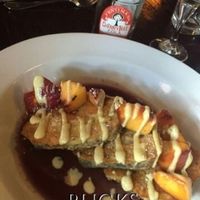 French toast with sliced peaches in season at Sprig and Vine in New Hope
