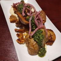 Crispy Smashed Potatoes:
preserved lemon sauce, sumac-marinated red onion, mint-parsley persillade, sea salt at Sprig and Vine in New Hope