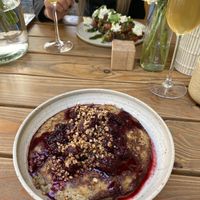 gluten free pancake with berry sauce and crunchy buckwheat sprinkles on top at Etapa in Prague