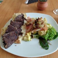 Lunch of the day: black bean patty on mashed potatoes. Salad with lettuce, avocado and tomato at El Arrebato in Medellin