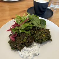 Kale pea fritters and soy coffee 👌🏻   at Cafe Stepping Stone in Canberra