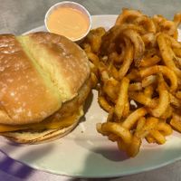 Breakfast sandwich and curly fries with aioli on the sidee  at The Bayside Cafe in Everett