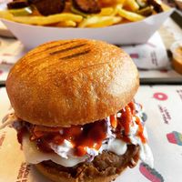 Spicy buffalo chik’n burger  at Nosh Cravings in Doha
