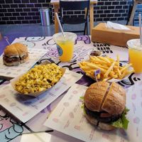 Check burger on left, loaded on right   at Nosh Cravings in Doha