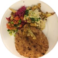 Cauliflower takeout transferred to a plate. at Tamam - Upper East Side in New York City