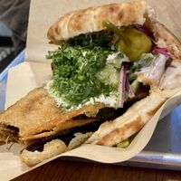 Sabich Pita, Spicy w/ a bite out of the eggplant (alternate angle)  at Tamam - Upper East Side in New York City