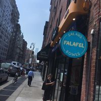 View from street, 30 minutes after official opening time. Notice the nervous customer with a huge order looks in vain for somebody to open up. at Tamam - Upper East Side in New York City
