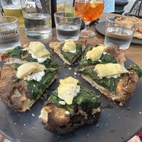 Vegan pizza (corn dough, spinach, cashew cheese, artichoke)!  at Fetiche in Ljubljana