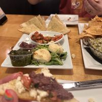 Bruschetta after we’ve each had a piece with vegan almond cheez  at Seva - Ann Arbor in Ann Arbor