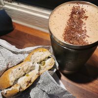 Vegan cream cheese bagel with jalapeño and hot chocolate at Skool Beans in Vik