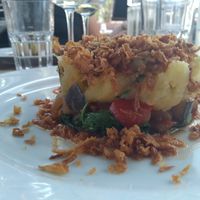 Parmentier of potatoes with summer veggies with young spinach at Gill Côté Bistro in Rouen