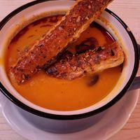 Mango pumpkin cream soup with roasted pumpkin seeds at Schönbrunner Stöckl in Vienna