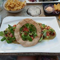 The big o salad, truffle fries and spring rolls at Nook in Stari Grad