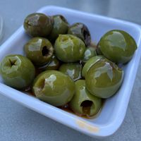 Olives in chili oil 🫒   at Square Peg Pizzeria in Glastonbury