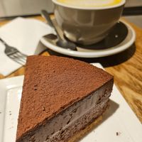 Eggless chocolate cake and Turmeric & honey latte with almond milk at Cedele - Raffles City in Central Singapore