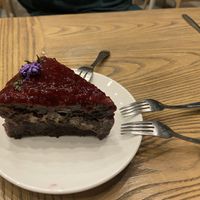 Peanut butter chocolate cake with raspberry - heavenly   at Plantiful - Plant-based Cafe in Bangkok