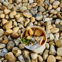Delicious Spicy lentil dal soup with coconut yoghurt 😊  at Kiosk in Lyme Regis