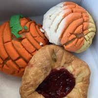 Halloween conchas & raspberry danish  at Toluca Bakery and Cafe in Los Angeles