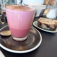 Pink dirty chai and vegan banana bread  at Hasard in Biel