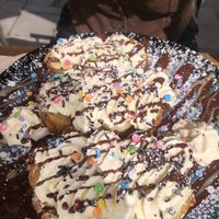 French Toast banana whipped cream and funfettis 👌  at Lucifer Lives in Brussels