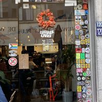 A lot of nice stickers at the door   at Lucifer Lives in Brussels