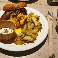 Egg and bacon bagle with rosemary potatoes at Lucifer Lives in Brussels