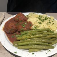 Meatballs with purée and beans  at Lucifer Lives in Brussels
