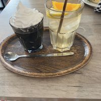 Black Metal (charcoal latte with a hint of vanilla) and homemade iced teaa  at Lucifer Lives in Brussels