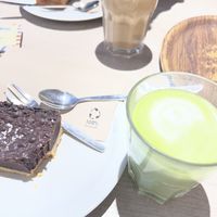 Carrot cake incl. cinnamon frosting and choco fudge shortbread with coffee and matcha lattee  at Lucifer Lives in Brussels