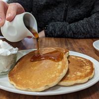 Vegan pancakes with maple syrup and whipped cream at The Greenwood Tree in Lyndhurst