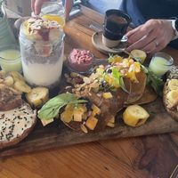 Brunch board (sweet) vegan amlou toast, fruit, hummus, and drinks   at Mandala in Essaouira