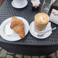 Latte with oat milk and vegan raspberry croissant at Havana Café in Bardonecchia