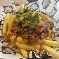 Fries with vegan mixed bean chilli and vegan cheese   at The Slamwich Club in Stoke-on-trent