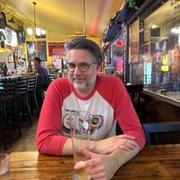 A happy German food-loving boy in a cute space at Urban German Wursthaus in Portland