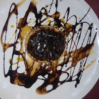 Chocolate tart it was delicious! My omni boyfriend was eating this with me and said you wouldn’t even know It was vegan!  at Jasmine Restaurant in Planos