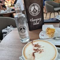 Soy milk cappuccino and nearly finished vegan apple pie at Craft Coffee Factory in Bratislava