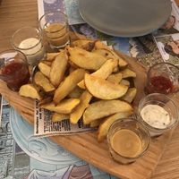 Wedge potatoes with vegan ali-oli, mustard and hot sauce at Barallocas in Pontevedra