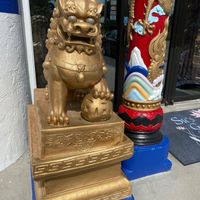Entrance has 2 foo dogs & lovely fish pond with waterfall. Aquarium inside  at Su's Garden in Marco Island
