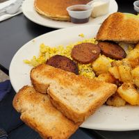 The hungry vegan - pancakes, tofu scramble, sausage, potatoes, toast at Donut Villa Diner in Malden